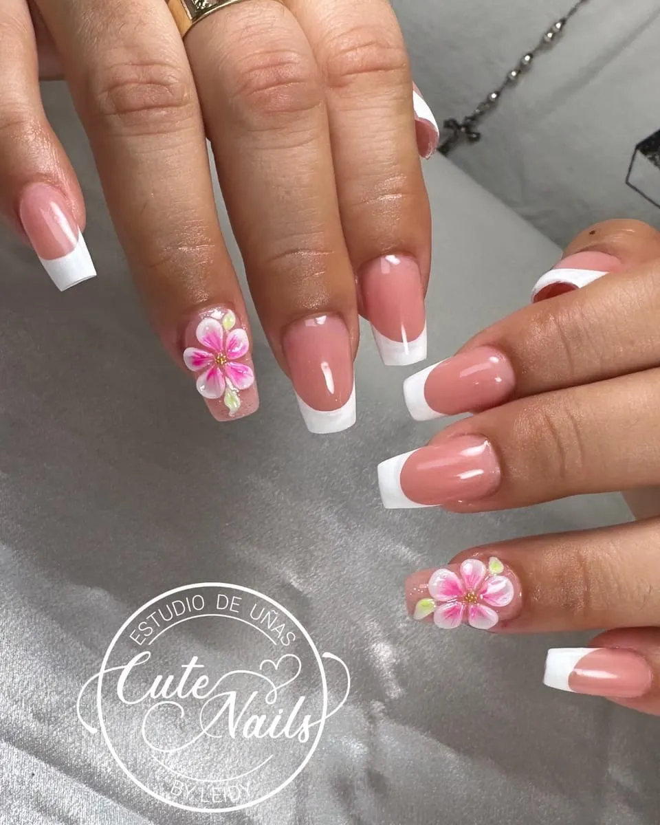 Classic white French tips with 3D pink flowers, made by Leidy in Fremont